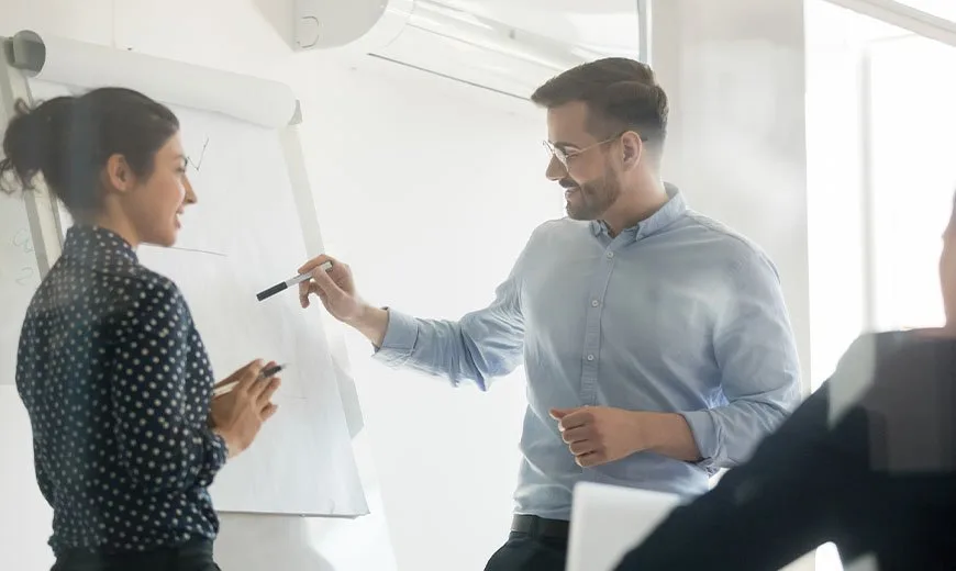 group of people training with white board